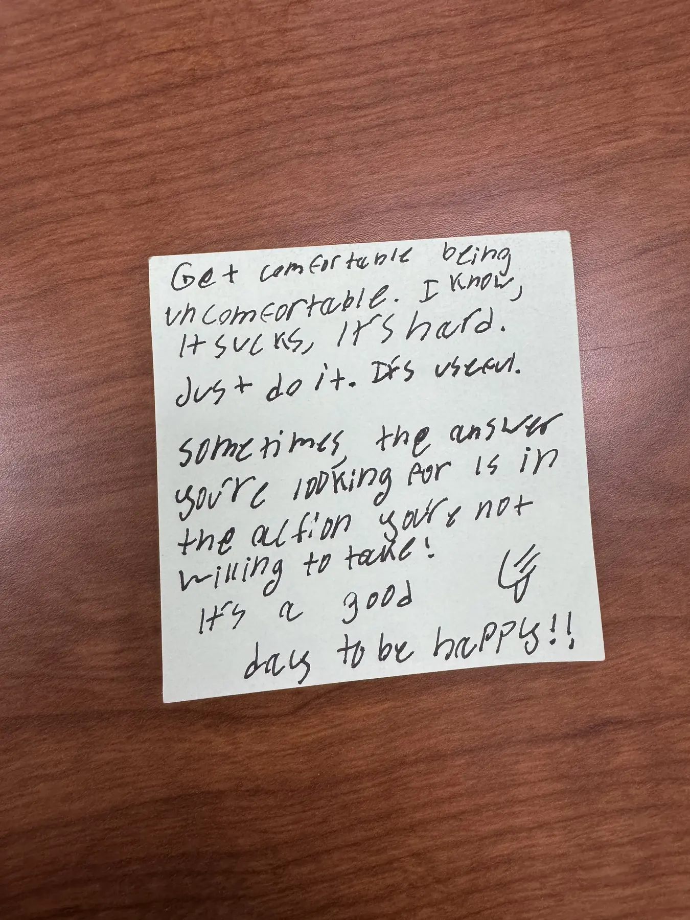 Handwritten sticky note with words of encouragement